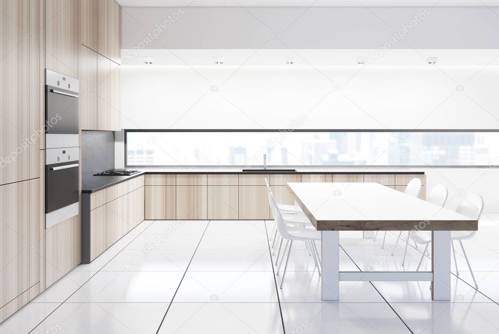 White kitchen with a table