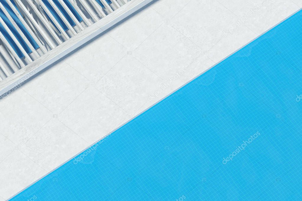 Top view of a swimming pool with blue deck chairs