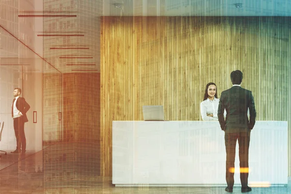 Business people near a reception in office toned — Stock Photo, Image