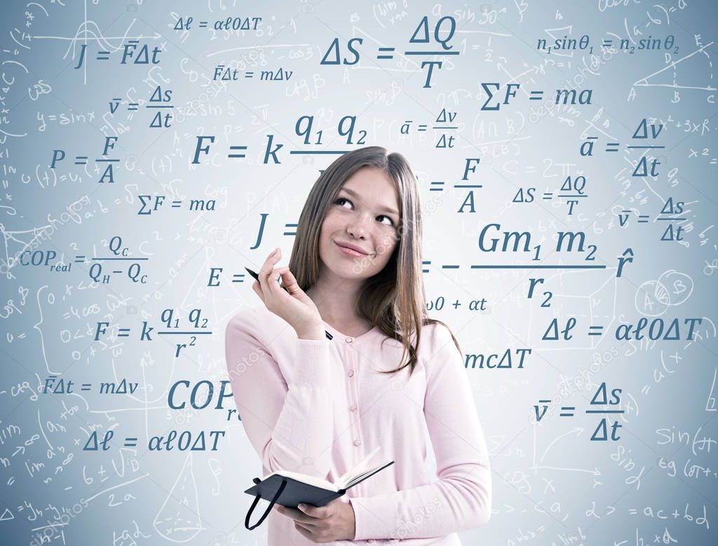 Dreamy girl in pink and physics formulas