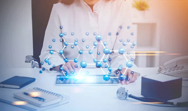 Woman doctor, office, carbon atomic grid — Stock Photo, Image