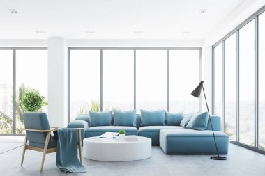 Mavi bir kanepe ile beyaz salon iç