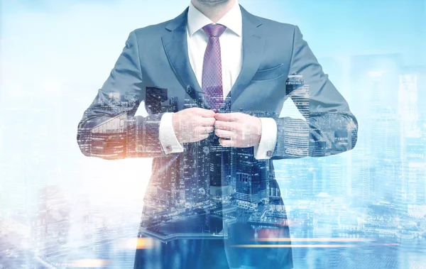 Businessman buttoning his suit in a city — Stock Photo, Image