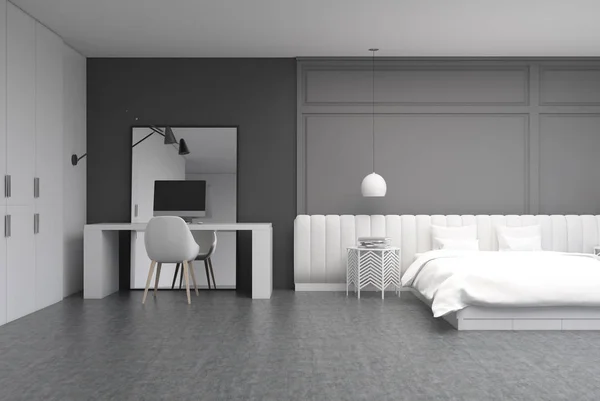 Camera da letto grigia con un home office — Foto Stock