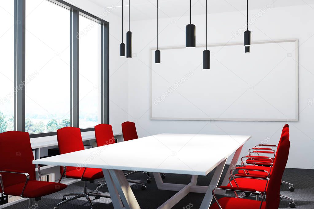 Meeting room with red chairs, whiteboard