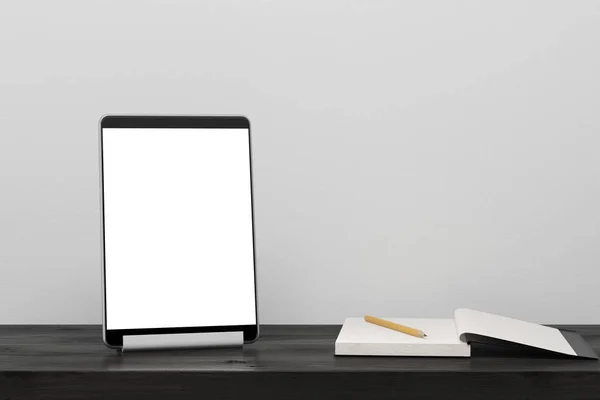 Tablet computer on a black wooden table — Stock Photo, Image