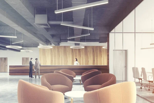 Resepsiyon alanı bekleyen bej koltuk tonda