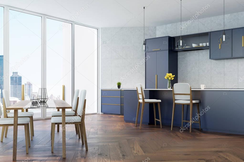 Gray and blue kitchen with a table