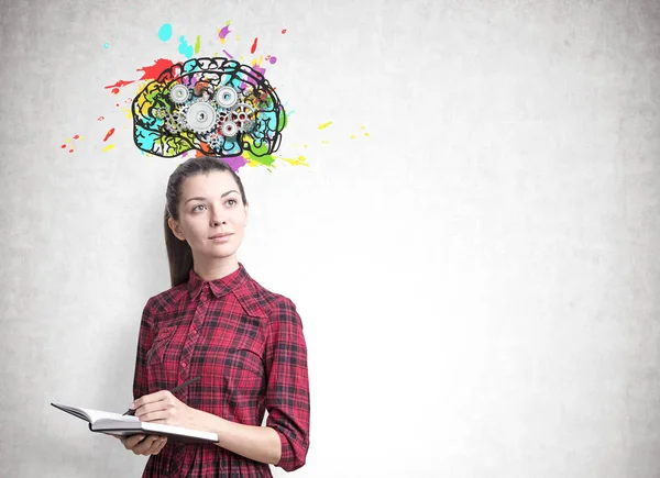 Mujer joven con un planificador, engranajes cerebrales — Foto de Stock