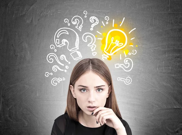 Pensive teen girl, light bulb, questions — Stock Photo, Image