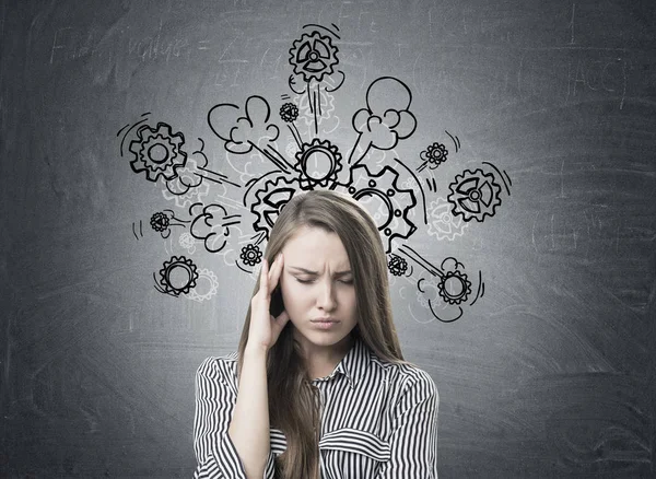 Stressed businesswoman, headache, cogs and gears — Stock Photo, Image