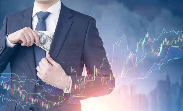 Man with dollar bills, graphs, blurred city — Stock Photo, Image