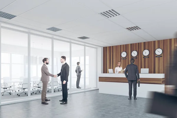 White and wooden reception, meeting room, men — Stock Photo, Image