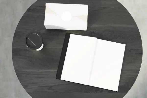 Ein offenes Buch und eine Schachtel auf einem runden Tisch — Stockfoto