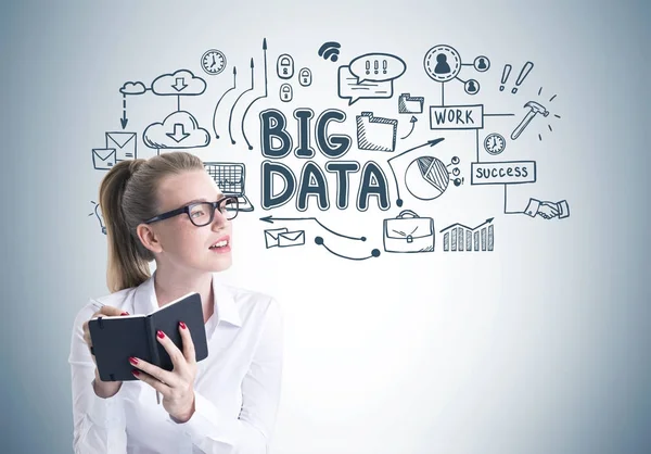 Young blonde woman in glasses writing, big data — Stock Photo, Image
