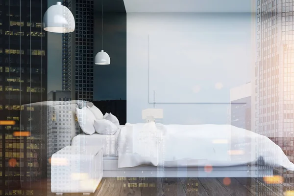 Siyah ve beyaz yatak tonda bir posteri ile