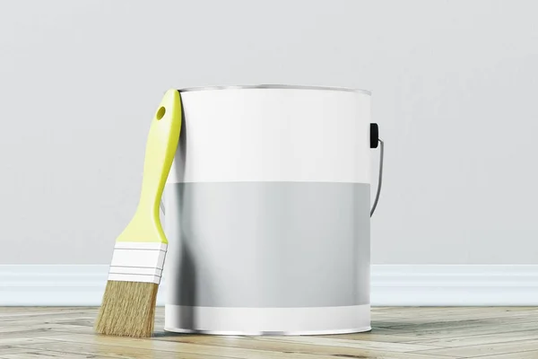 Gray paint bucket and a brush — Stock Photo, Image