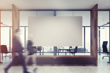 Açık alan office, kahverengi kanepe ve tonda poster