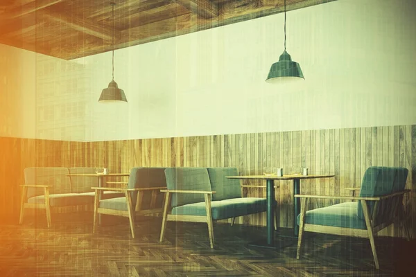 White and wooden cafe interior, sofas side toned