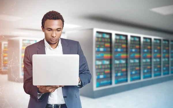 African American man, laptop server room polygons — Stock Photo, Image