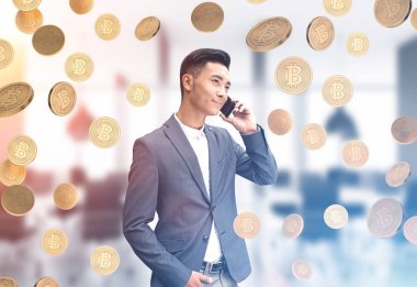 Telefon, bitcoin yağmur Asya iş adamı