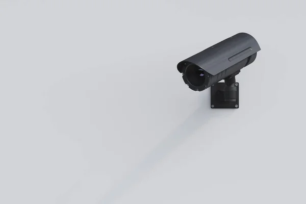 Black CCTV camera on a white wall — Stock Photo, Image