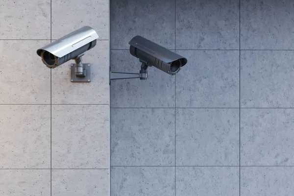 Gray cameras on a gray wall — Stock Photo, Image