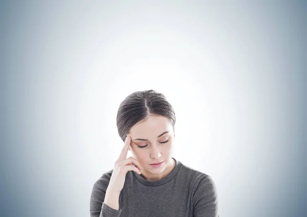 Stressed young woman in brown, gray — Stock Photo, Image
