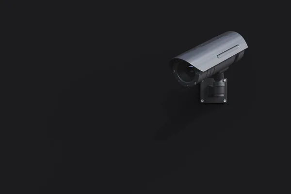 Чорна камера відеоспостереження на чорній стіні — стокове фото