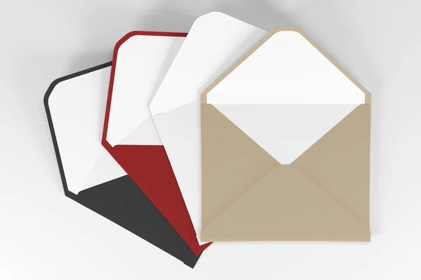 Envelopes coloridos em uma superfície branca — Fotografia de Stock