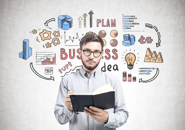 Intelligent young man with planner, business idea — Stock Photo, Image