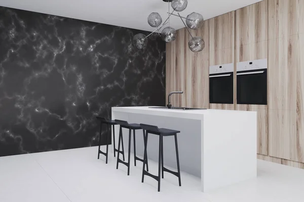 Wooden kitchen with bar side, black marble closeup