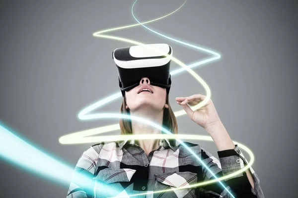 Woman in VR glasses, lines hologram — Stock Photo, Image