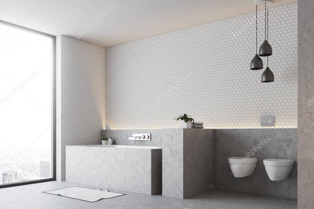 White bathroom, gray tub and toilet