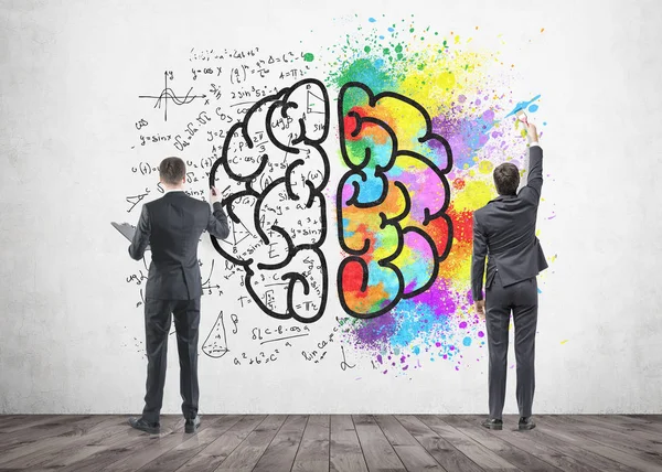Deux hommes d'affaires dessinent un croquis cérébral, en béton — Photo