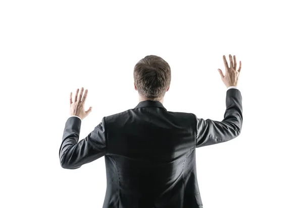 Rear view of a businessman with hands in the air — Stock Photo, Image