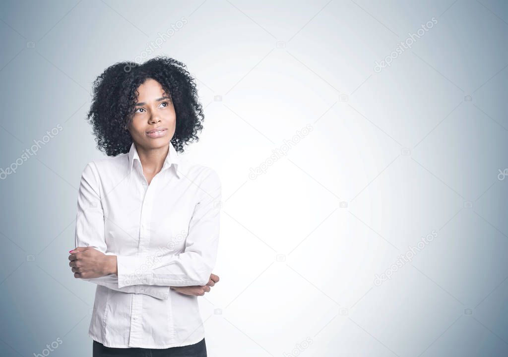 Pensive African American businesswoman, gray