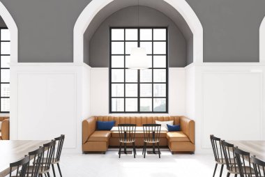 Beyaz ve gri kafe iç, kanepe, tablolar