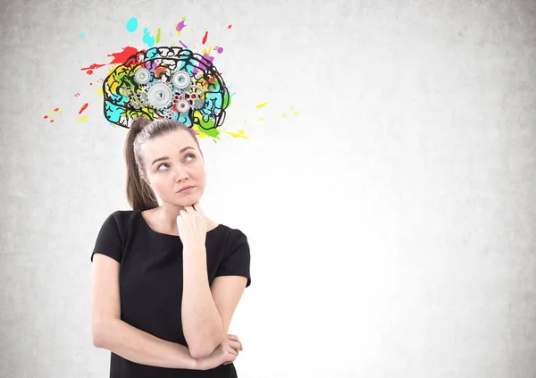 Pensive woman in T shirt, cog brain — Stock Photo, Image