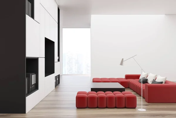 White and black living room, TV, red sofa — Stock Photo, Image