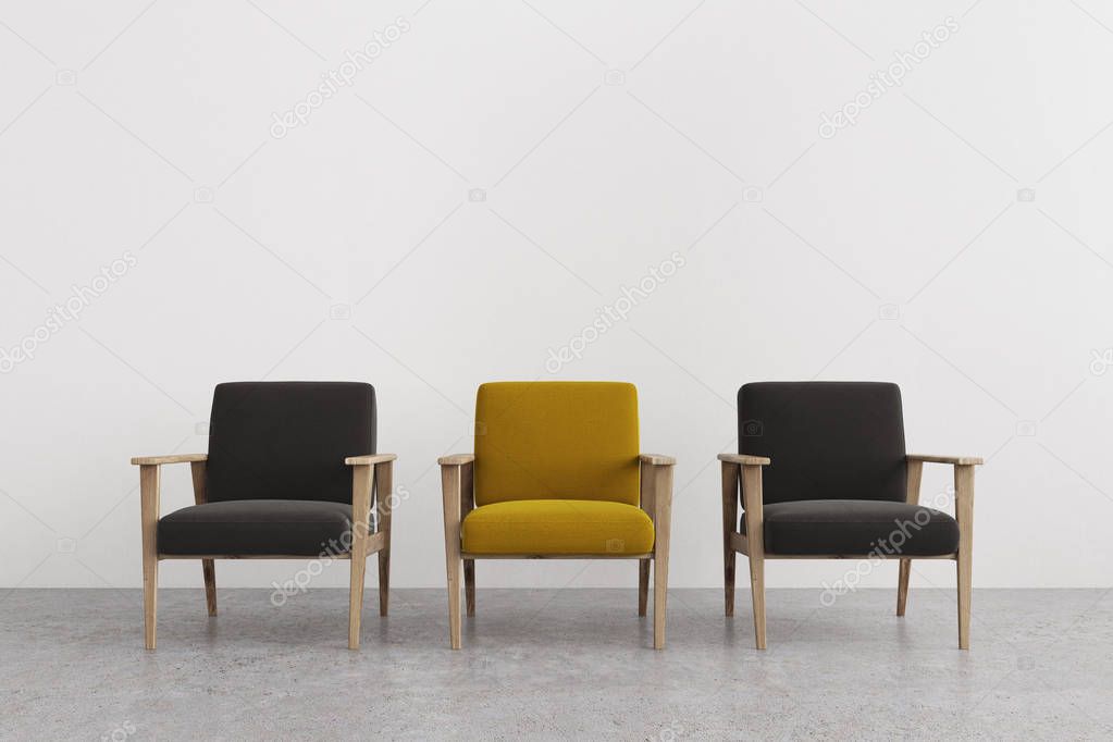 Black and yellow armchairs in an empty room