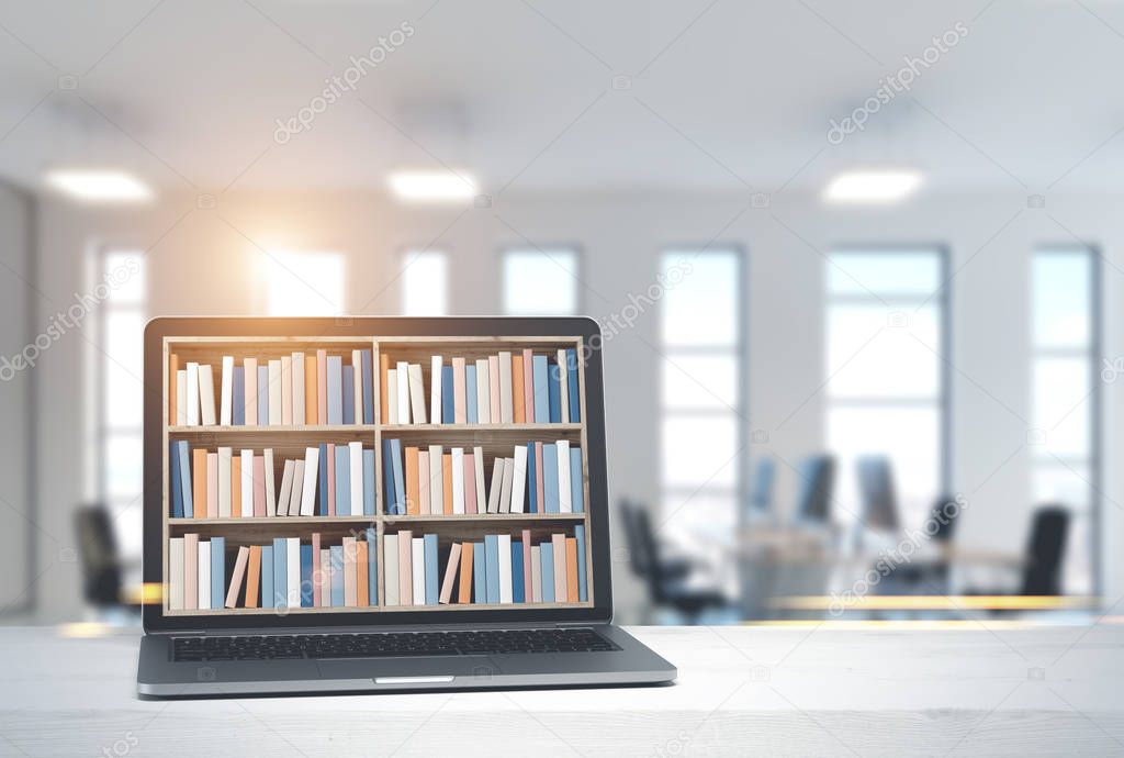 Laptop with bookshelves on screen, office side