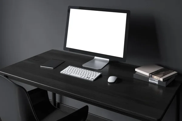 Κενή οθόνη του υπολογιστή σε μια πλευρά μαύρο ξύλινο γραφείο — Φωτογραφία Αρχείου