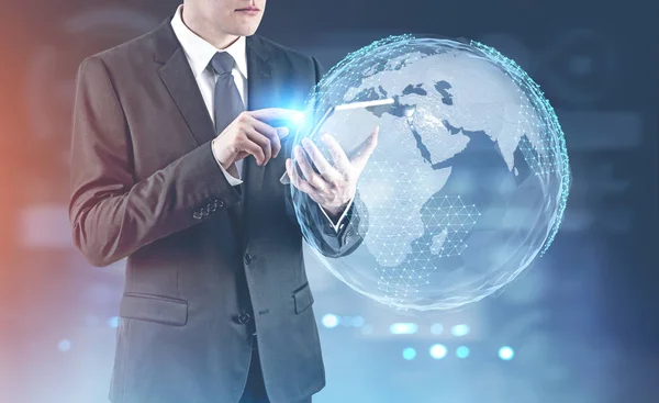 Businessman with a digital tablet, Earth — Stock Photo, Image