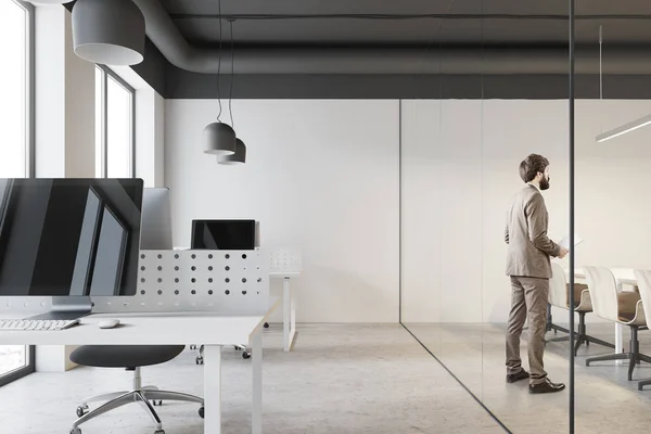 Businessman in a white office — Stock Photo, Image