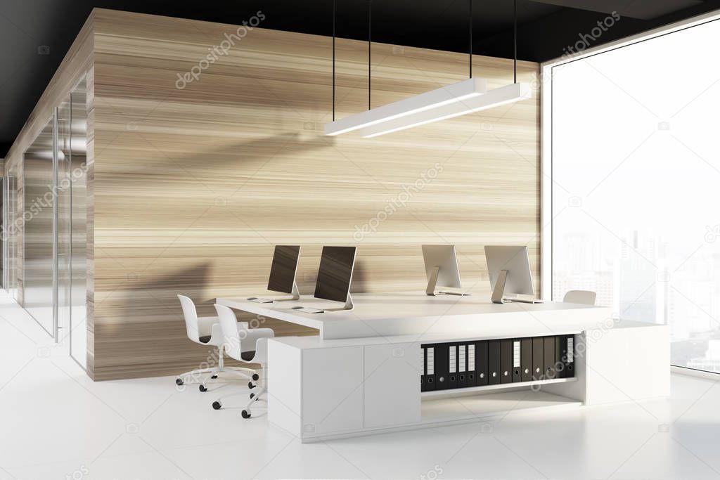 Black ceiling office corner, computer screens