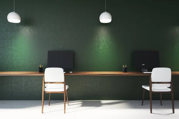 Green office interior, computer screens