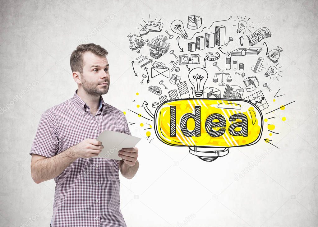 Bearded young man holding paper, business idea