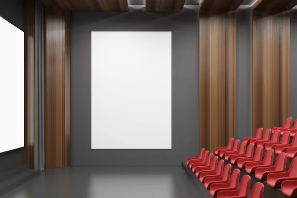 Cinema interior, red chairs, poster