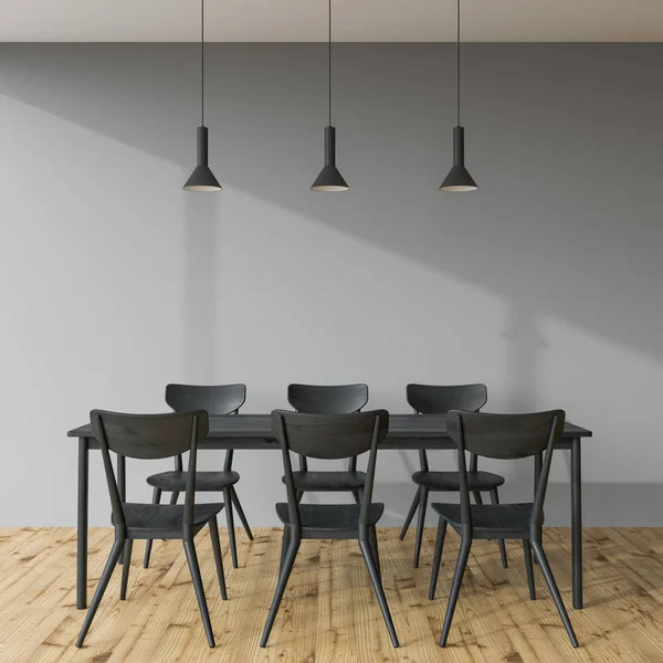 Dunkelgrauer Esstisch in einem grauen Raum — Stockfoto